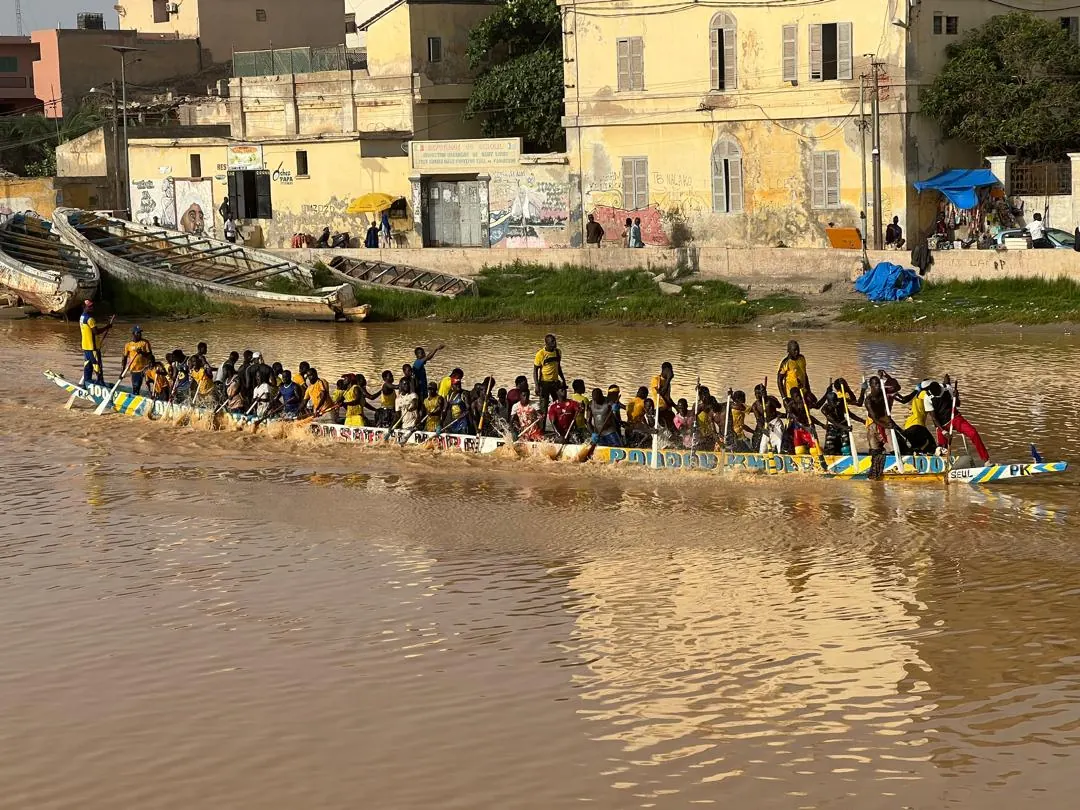 Pirogues racing on the river in Saint-Louis