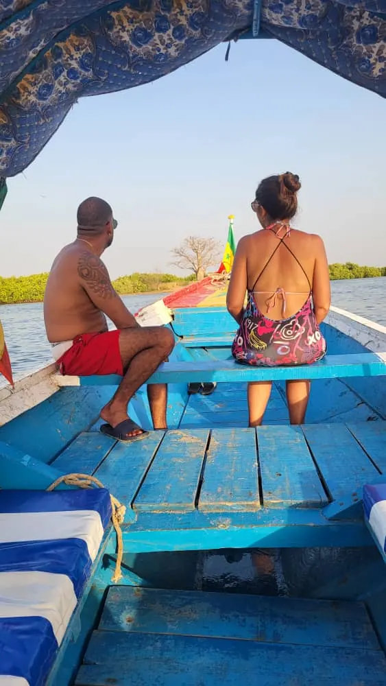 Couple in a pirogue at the end of the day