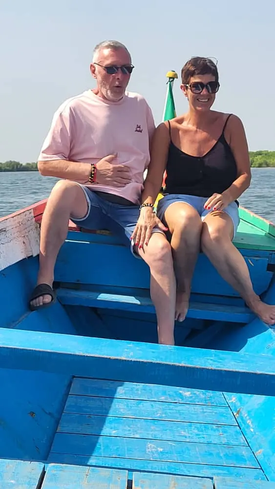 Couple in a pirogue on the lagoon
